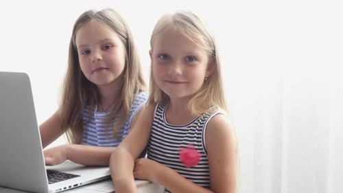 Two Girls Using Laptop Computer Together