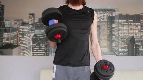Man Does Bicep Curls in Home Gym