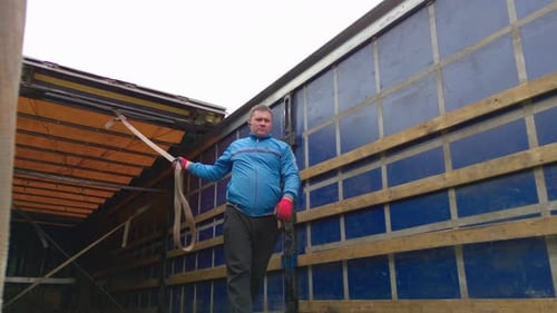 Man Working Inside Open Truck Cargo Area