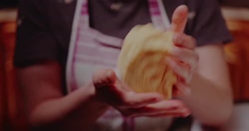 Hands Preparing Dough for Baking in Home Kitchen