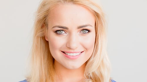 Blonde Woman Smiles and Looks to the Side