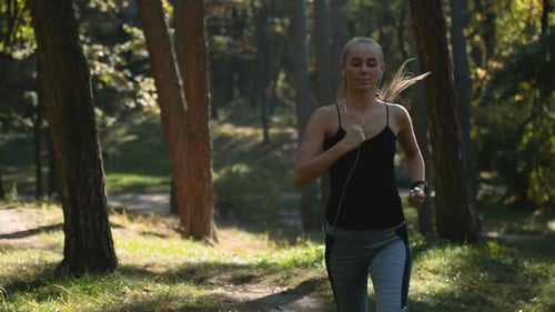 Woman Runs in Forest