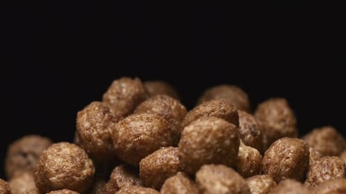 Chocolate Cereal Puffs Pouring, Macro Shot