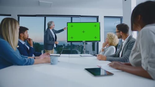 Diverse Team Meeting with Green Screen Presentation