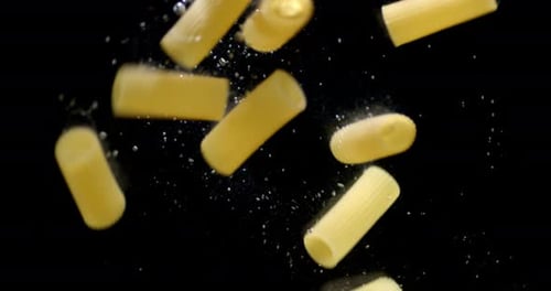 Cannelloni Pasta Dry Falls Under Water with Air Bubbles.