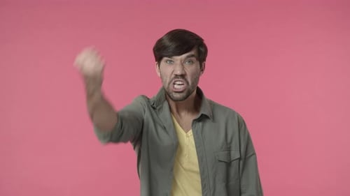 Angry Man Yelling and Pumping His Fist