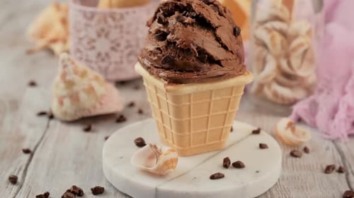 Chocolate Ice Cream in Waffle Cone with Sprinkles