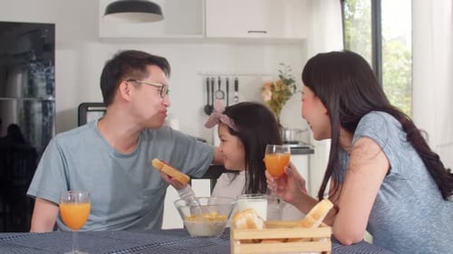 Family Enjoys Mealtime Together in Bright Kitchen