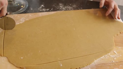 Cutting dough for gingerbread house