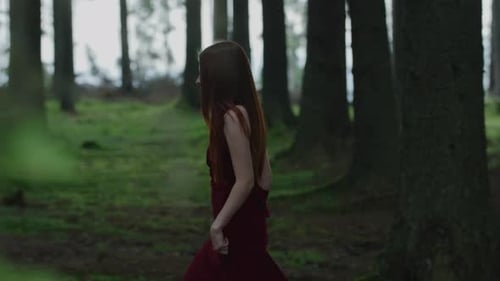 Girl walking in a forest