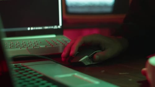 Professional Hacker Typing on Keyboard at Night Closeup of Man Hands Trying to Break Password Using