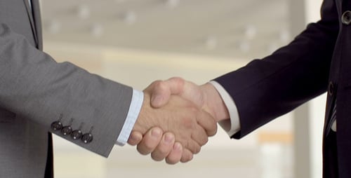 Business Handshake Close-Up in Modern Office Setting