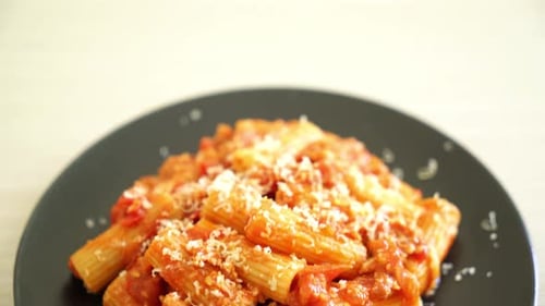 Pasta with Tomato Sauce and Parmesan Cheese Close Up