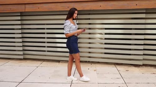 Young Woman Taking Cell Phone Call in City