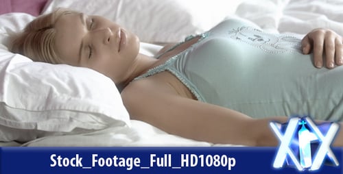 Woman Sleeping Peacefully in Bed in the Daytime