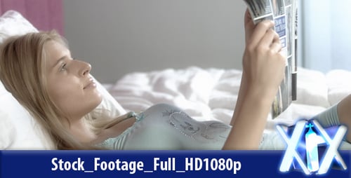 Blonde Woman Reading a Magazine in Bed