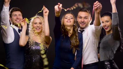 Adults Celebrate with Confetti at a Party