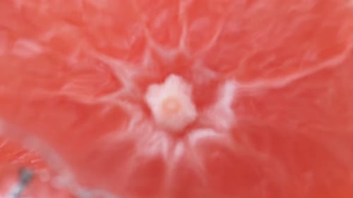 Macro Shot of a Grapefruit with Water Droplets