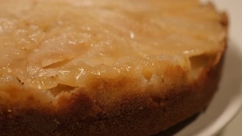 Tasty apple pie in baking tray close-up 4K 2160p 30fps UltraHD tilting footage - Slow tilt over ba