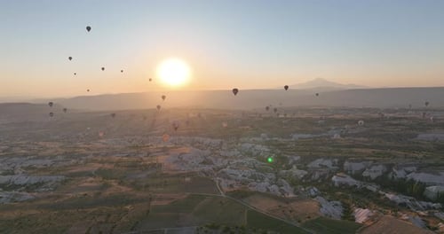 Aerial Cinematic Drone View of Colorful Hot Air Balloon Flying Over Cappadocia