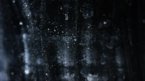 Abstract Light Particles and Smudges on Black Background