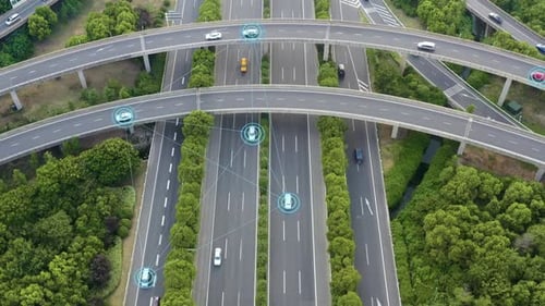 Aerial View of Highway Interchange with Autonomous Vehicles