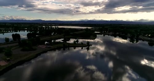 Be humbled in awe at this sunset taken by drone of the Rocky Mountains with reflections in the lakes