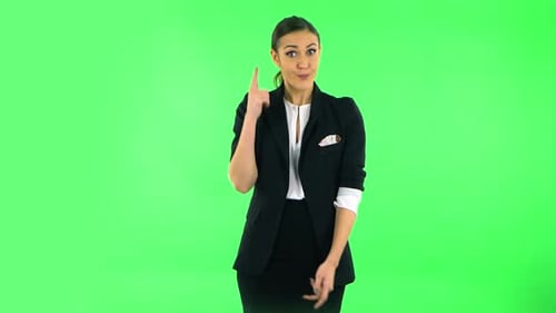 Indignant Woman Throwing Up Hands Expressing She Is Innocent, Twists His Finger at His Temple. Green