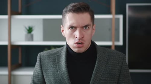 Businessman with Angry Facial Expression is Screaming Out Loud at Office