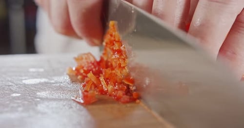Red Bell Pepper Being Chopped with Knife