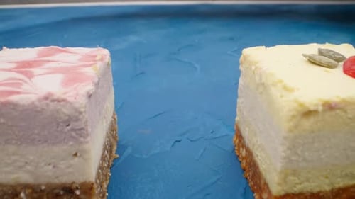 Colorful Vegan Cheesecakes on a Blue Surface