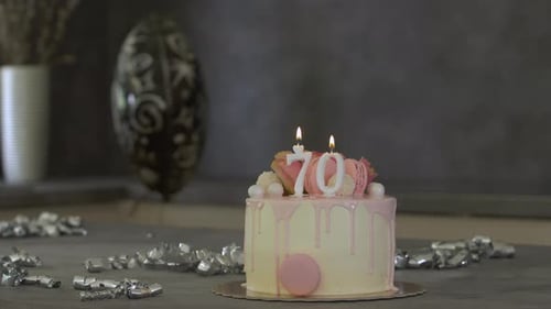 Celebration Cake with Candles Lit on Table