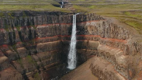 Aerial View of Hengifoss Waterfall Cascade Mountain Plateau and River in Iceland