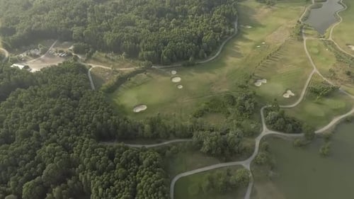 Aerial View of Large Luxury Golf Course. View of the Green Lawns and Trees. Shooting From Above, Top