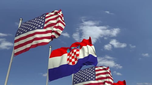 Waving Flags of United States and Croatia in Blue Sky