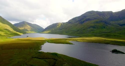 Lake surrounded by beautiful mountains 4k