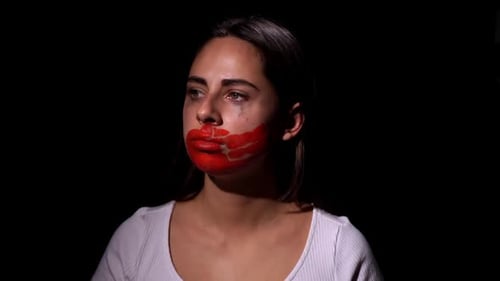 Distressed Woman with Red Smeared Around Mouth