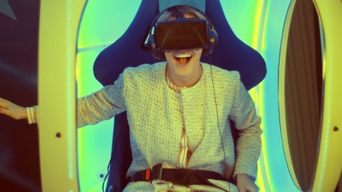 Woman Enjoys a Virtual Reality Experience with VR Headset
