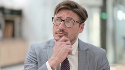 Portrait of Pensive Businessman Thinking an Idea