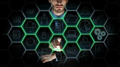 Man Selects Icons on Futuristic Touch Screen