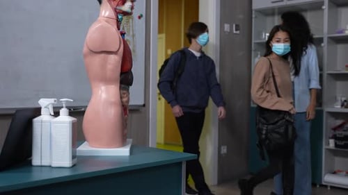 Students Entering Classroom During Medical Lecture