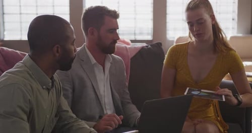 Young creative professionals working in a modern office