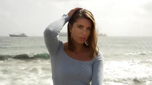 Stunning Portrait Shot of Model with View of the Ocean in Background