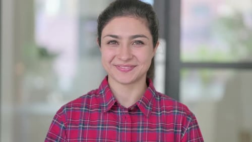 Woman Smiles and Gives Thumbs Up