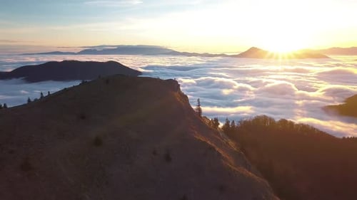 Mountain Top View Above Clouds at Sunrise