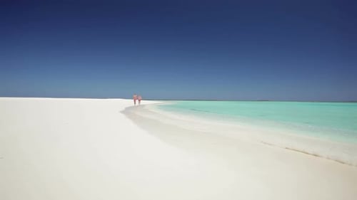 Running Couple on Sandy Beach