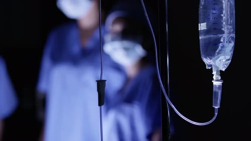 Closeup of iv dripping operating room
