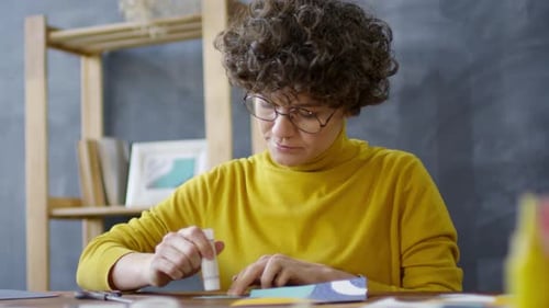 Artist Glues Colorful Paper in Home Studio