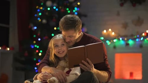 Father and Daughter Reading Christmas Story