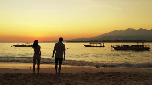 Man and lady sunbathe on idyllic sea view beach wildlife by aqua blue ocean and white sandy backgrou